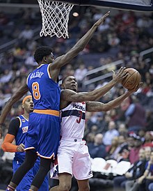 Holiday guards Bradley Beal of the Washington Wizards during a 2017 game Bradley Beal (32639995105).jpg