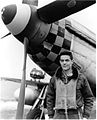 Tordoff as a pilot during World War II, posing in front of his P-51