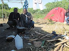 Sudanese migrants in Calais Jungle, June 2015 Calais refugee camp 3.JPG