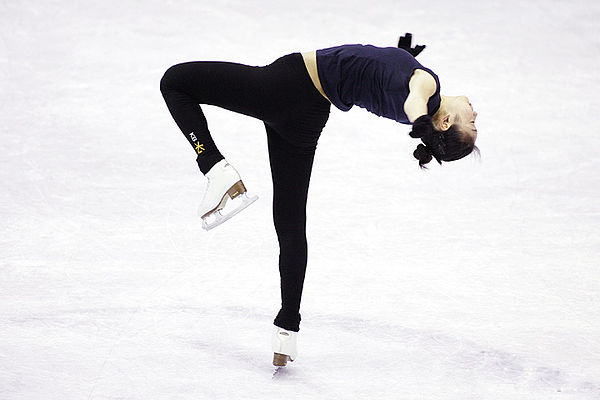 Yu-Na Kim performs a bent-leg layover spin at the 2008 Grand Prix Final.