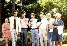 Bush (center) with his family Campaign photo of the Bush family, the boys have their ties thrown over their shoulders (left to right- Doro, George, Jeb, Marvin, George W., Neil, and Barbara).jpg