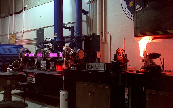 A test target bursts into flame upon irradiation by a continuous wave kilowatt-level carbon dioxide laser. Carbon Dioxide Laser At The Laser Effects Test Facility.jpg