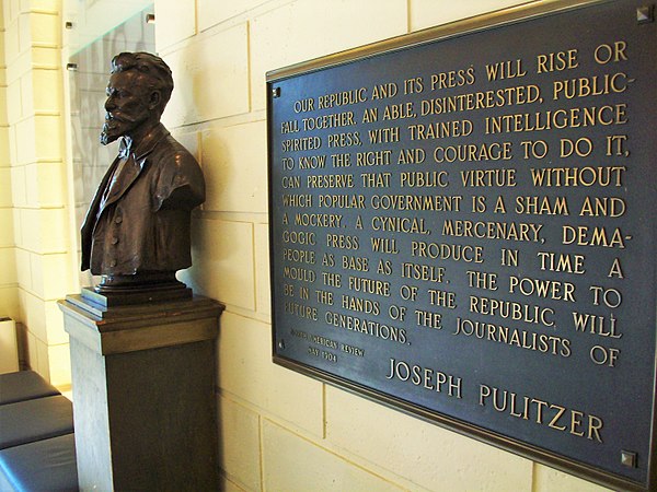 A bust of Joseph Pulitzer and plaque in the Columbia Journalism School lobby