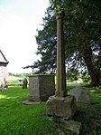 Cross in the churchyard of St John the Baptist 15 m south east of the church door