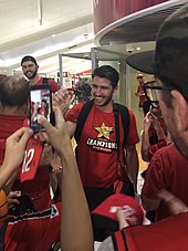 Martin in March 2019, arriving back in Perth after winning his fifth NBL championship Damian Martin and Angus Brandt 01.jpg