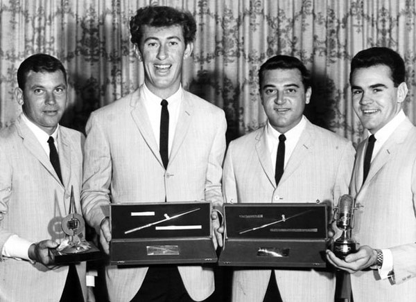 The Delltones with four radio awards, (l to r) Warren Lucas (tenor), Ian (Peewee) Wilson (bass), Brian Perkins (baritone) and Col Loughnan (lead)