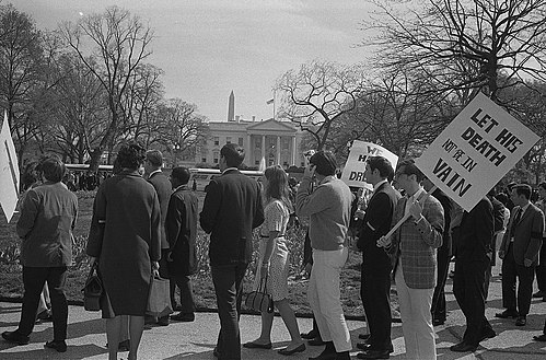 Demonstrator with sign saying "Let his death not be in vain", in front of the White House, after the assassination of Martin Luther King