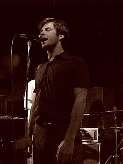 Travis Morrison performing with the Dismemberment Plan at the Iowa Union Basement c. 2001 Dismemberment plan 3.jpg