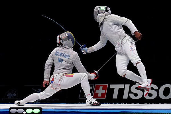 Homer (R) scores from a flunge at the 2015 World Fencing Championships