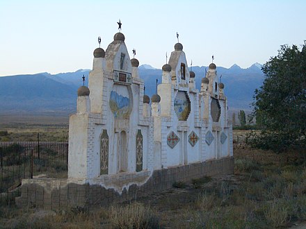 Monuments in an old rural cemetery combine Muslim crescents and Communist stars