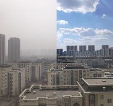 Un paesaggio urbano nebbioso a destra e uno chiaro a sinistra