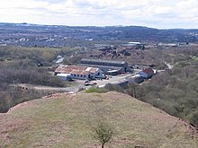 Former Broxburn shale oil works, taken from the top of the bing of spoil from the works. The surviving buildings of the works, now known as Albyn Industrial Estate, are in the middle of the picture. The villages of Broxburn and, to the right, Uphall are beyond and Livingston is visible on the skyline.