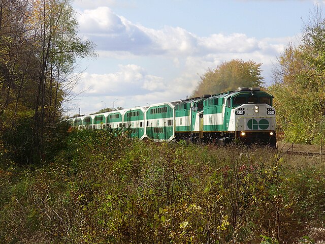 GO Train approaches a level crossing at Galloway Road in Scarborough