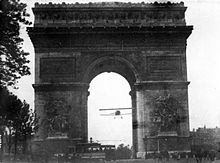 Charles Godefroy flies a Nieuport fighter through the Arc de Triomphe in 1919 Godefroy flight.jpg