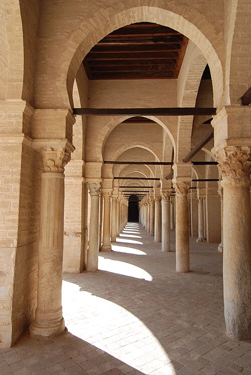 Arcades inside the Mosque of Uqba, also known as the Great Mosque of Kairouan, in Tunisia (670). There is no vaulting; the arches are bridged by woode