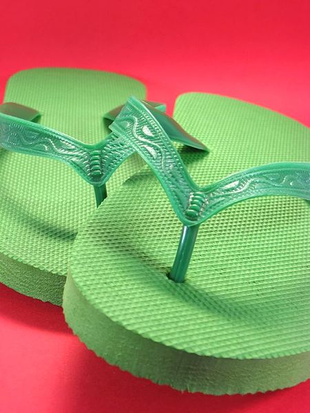 File:Green flip flops on red background 2.jpg