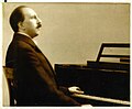 Hans Neumeyer at his piano, around 1920-1930