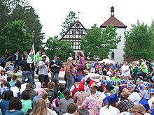 Immediately before the International Day festival closing program, in front of Waldsee's Bahnhof administrative building IDay.JPG