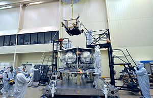 Juno Radiation Vault (the box being lowered onto the partially constructed spacecraft) in the process of being installed on Juno, 2010 Installing Juno's Radiation Vault.jpg