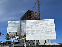 Billboard with CGI mock up of finished building. Jean Monnet 2 building construction billboard, 25 March 2023.jpg