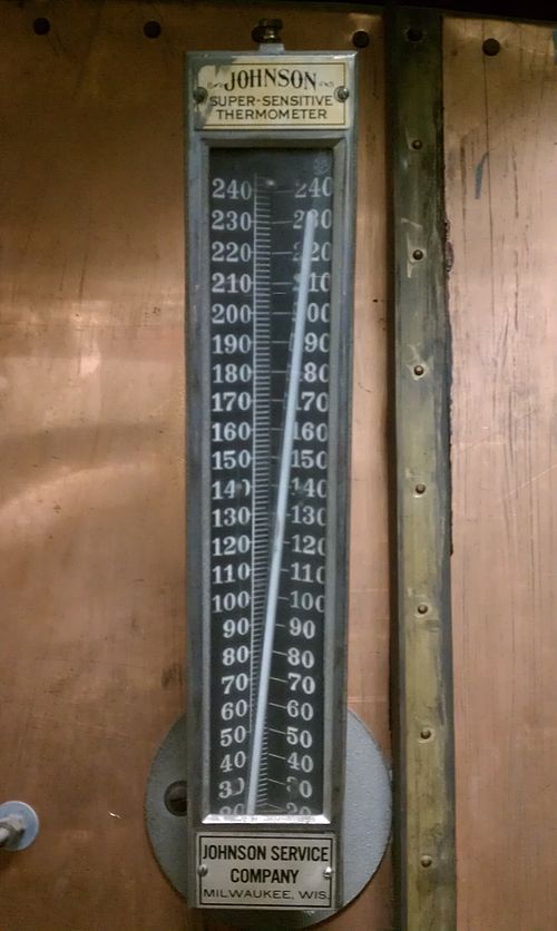 A Johnson Super-Sensitive Thermometer on an old air conditioning unit