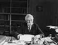 Justice Oliver Wendell Holmes at desk.jpg