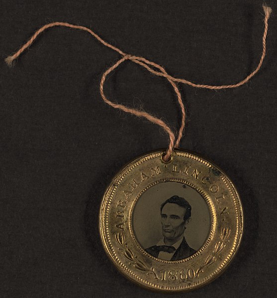Presidential campaign button for Abraham Lincoln, 1860. The reverse side of the button shows a portrait of his running mate Hannibal Hamlin.
