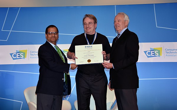 Linus Torvalds receiving 2018 IEEE Masaru Ibuka Consumer Electronics Award from ICCE 2018 Conference Chair Saraju P. Mohanty and IEEE President James 