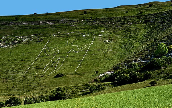 Watkins believed that the Long Man of Wilmington in Sussex depicted a prehistoric "dodman" with his equipment for determining a ley line.