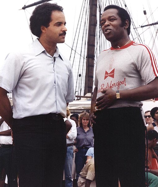 Lou Rawls (right) at Baltimore's Inner Harbor (1980) being interviewed by local news anchor Curt Anderson, promoting the Lou Rawls Parade of Stars Tel