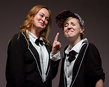 Mamrie Hart (no relation) and Hannah Hart onstage at No Filter in December 2013, held in Portland, Oregon