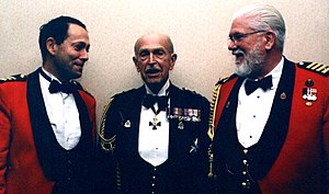 Three Canadian officers in shawl or rolled collar jacket and waistcoat style mess dress or mess kit. Miniature medals and other accoutrements are also worn. Messkit1.jpg