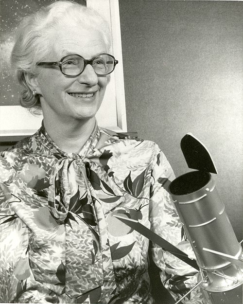 Nancy Grace Roman with a model of the Large Space Telescope that was eventually developed as the Hubble Space Telescope. While listed as a 1966 photo,