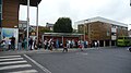 English: A large queue of passengers waiting for Southern Vectis route 9 in Newport, Isle of Wight bus station. The usual summer holidays + not so good weather = everyone flocks to Newport and gridlocks it has occurred, and so route 9 was severely delayed. I had got of a route 9 stuck at the top of Staplers (see File:Newport Staplers Road traffic queue.JPG and File:Southern Vectis 194 HW52 EPP and Newport Staplers Road traffic queue.JPG), and walked into Newport quicker than all the traffic. Fortunately, shortly after the photo was taken, a bus was brought round from the parking area and put on route 9, which helped clear the queue, although it did take them a while to do anything about it all.