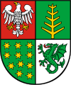 The coat of arms of the Ostrów County.