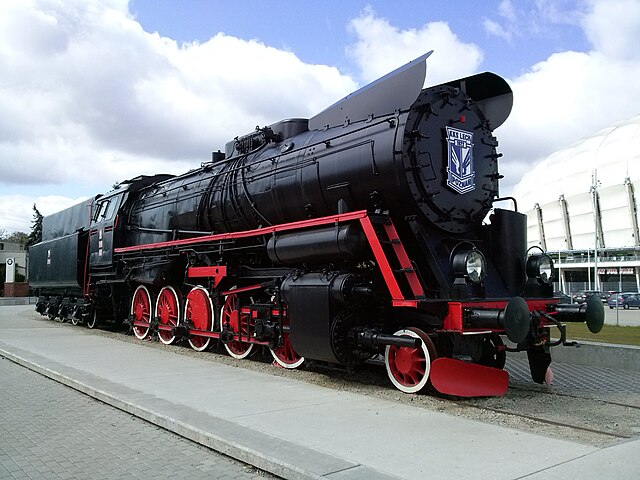 Historic Ty51 steam locomotive with the Lech Poznań crest, representing the club's traditions, by the stadium in Poznań