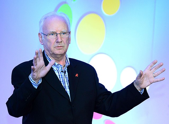 Along with Matt Aitken and Mike Stock, Pete Waterman (pictured in 2014) wrote and produced Kylie
