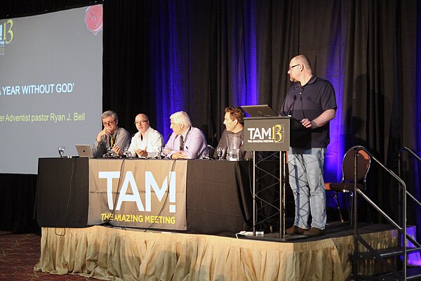 Saunders (left) in 2015, on the Podcaster Panel at TAM13