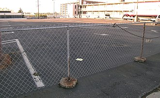 Parking lot where the Ponchartrain Apartments once stood Ponchartrain Apartments Detroit DEMOLISHED.jpg