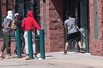 Rioters break windows in businesses in Saint Paul, Minnesota, May 28