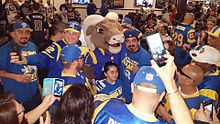 Rampage posing with fans of the Rams shortly after the team announced its relocation back to Los Angeles in 2016. Rampage-LA-fans.jpg