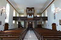 Vue intérieure de la nef vers la tribune d'orgue