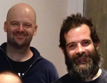 Brothers Dan Houser (left) and Sam Houser (right) are two of the co-founders of Rockstar Games. Dan left the company in 2020; Sam is the president. Sam Houser and Dan Houser (cropped).png