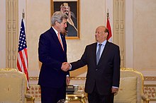 Ousted Yemeni President Abdrabbuh Mansur Hadi with U.S. Secretary of State John Kerry, 7 May 2015 Secretary Kerry Shakes Hands With Yemeni President Hadi Before Bilateral Meeting in Saudi Arabia (17212641020).jpg