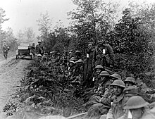 Members of the 82nd Division on the road to Ravin aux Pierre (lit. "Stone Ravine") France, October 1918. Signal Corps 82nd Airborne Meuse-Argonne.jpg