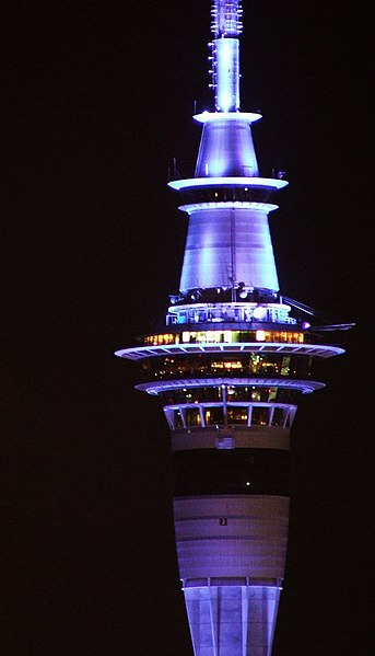 The upper sections of the Sky Tower, illuminated at night
