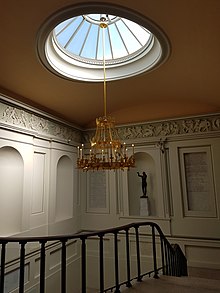 Stairway with skylight Skylight, chandelier and stairs, Ashmolean Museum, Oxford.jpg