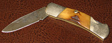 Medium-sized lockback knife with deer-antler grips, nickel-silver bolsters and brass liners Small lockback Damascus antler.JPG