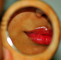 Sparkly lip gloss in mirror.jpg