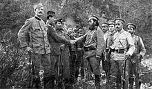 A group of Serb insurrectionists surrendering to IMRO comitadji Tane Nikolov after the rebellion. Tane Nikolov at First world war.jpg